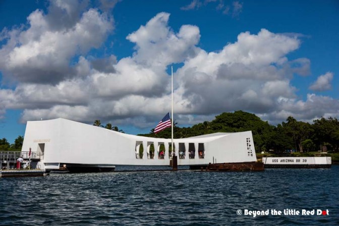 The USS Arizona memorial which straddles across the wreck of the battleship that sank during the attack on Pearl Harbor. More than a thousand sailors died that day and their bodies are still trapped underwater.