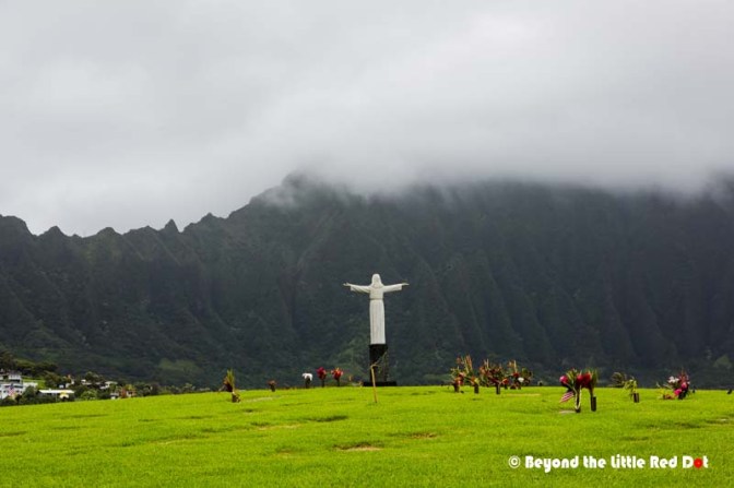 A solitary Jesus statue looks over the cemetery. 
